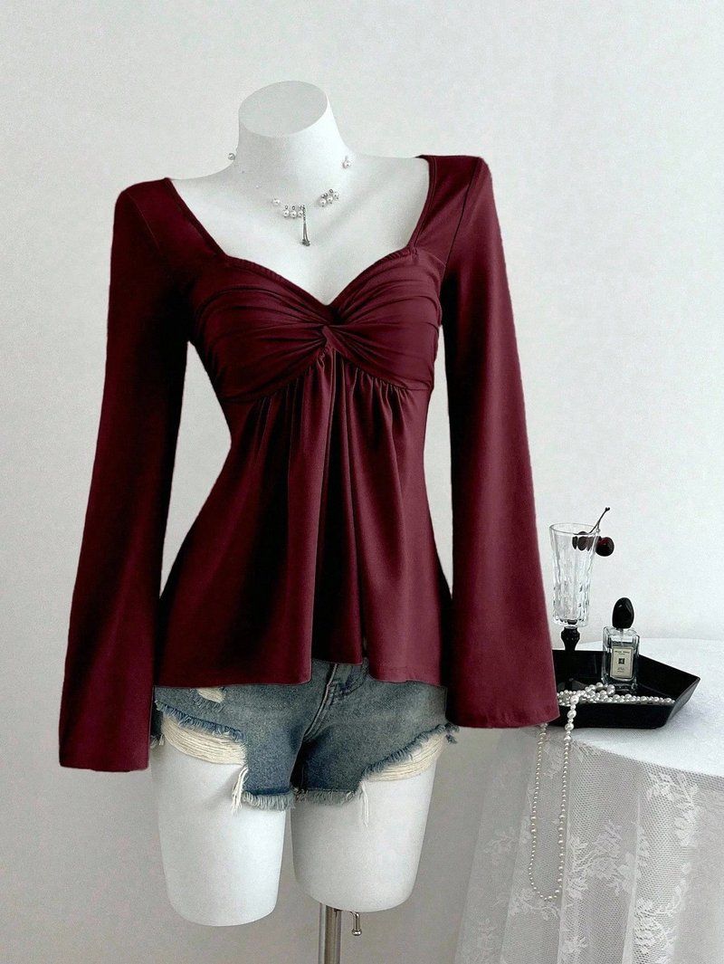 Elegant Twist Front A-Line Top
